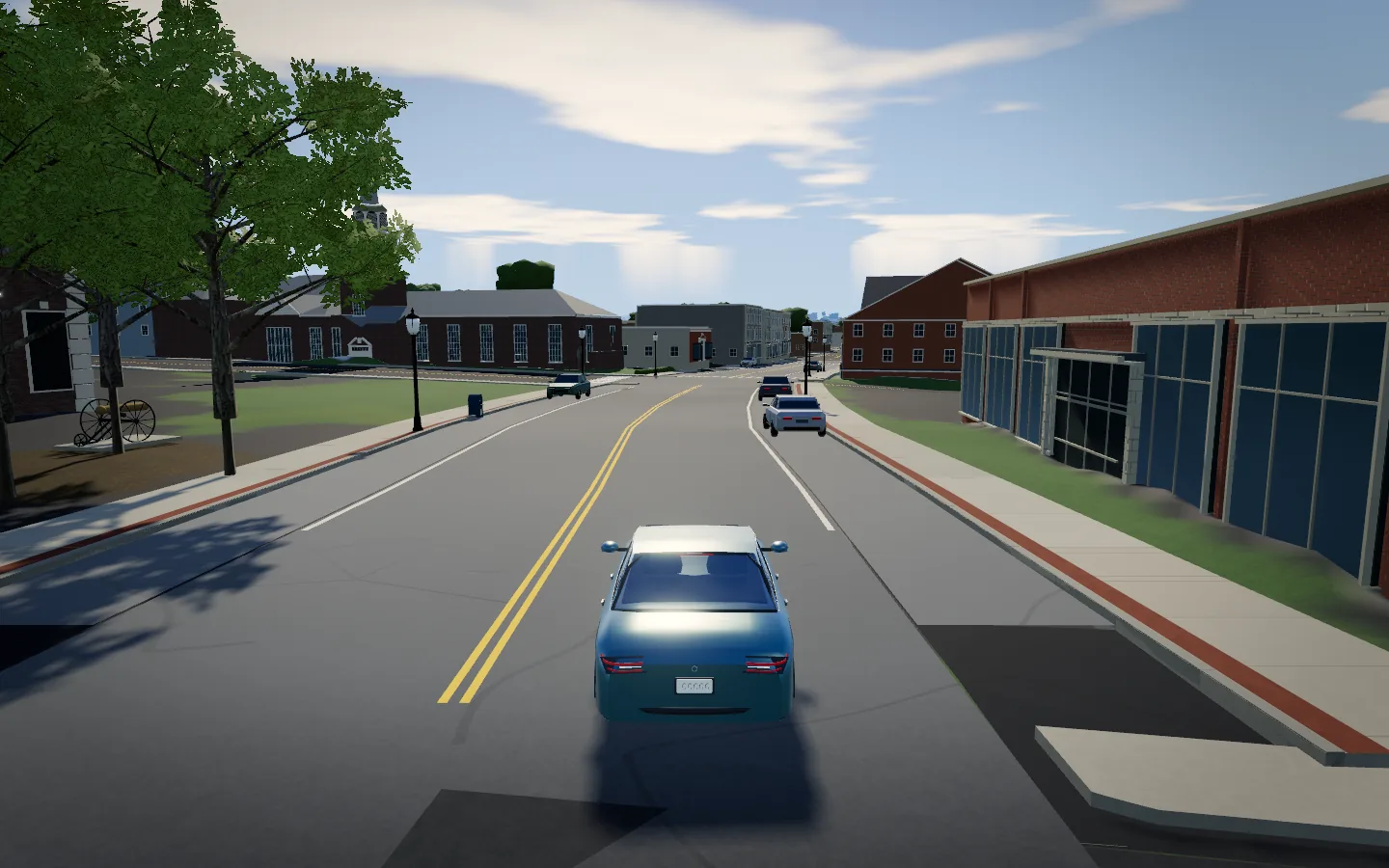 Main Street in the driving game: a brick church and clocktower, leafy summer trees, and a teal car on the road.